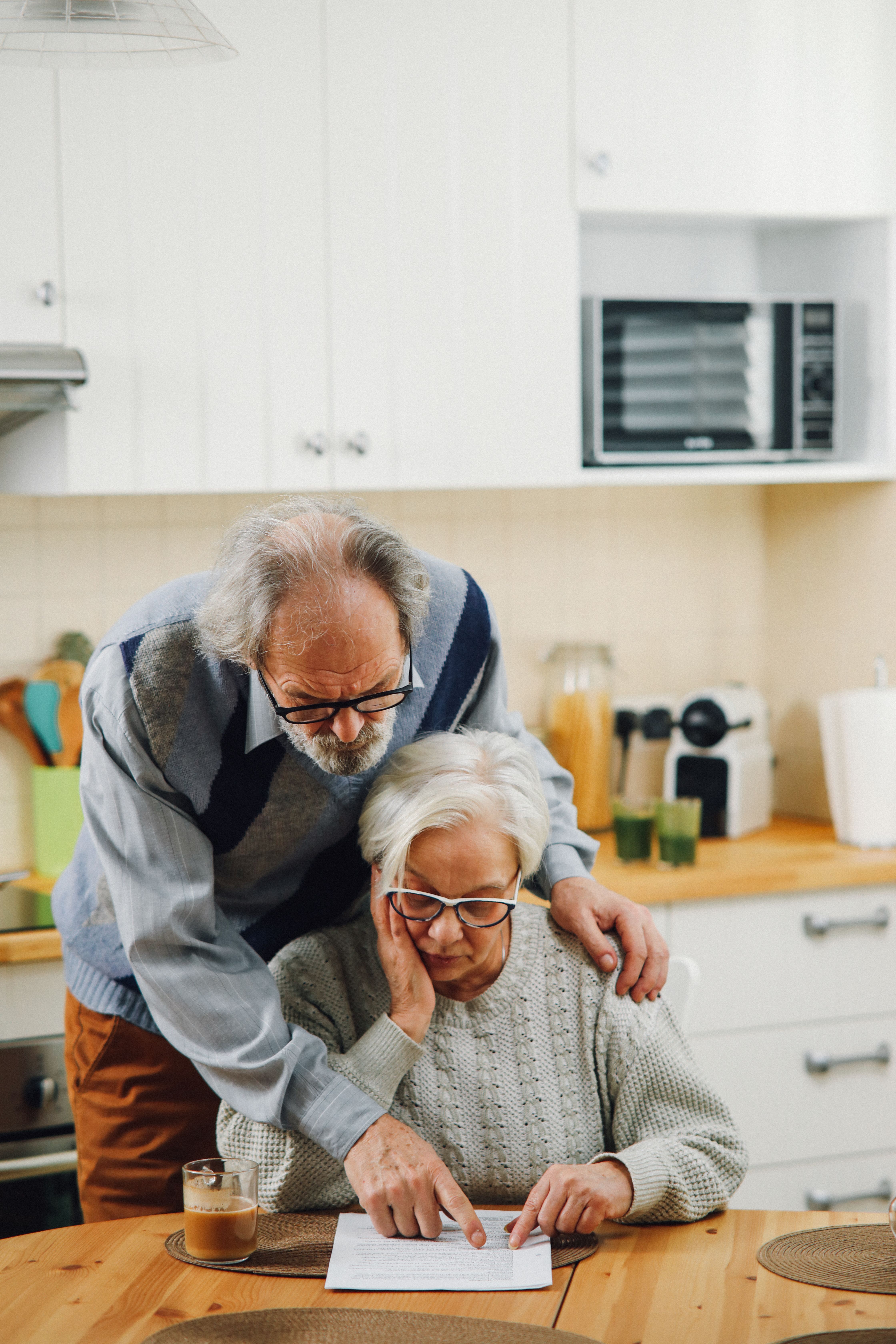 Senior couple having a cheerful conversation at home